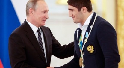 Путин вручил государственные награды олимпийцам.