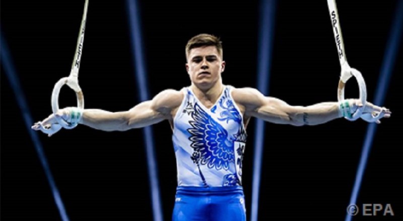 Упражнение на кольцах выполняет неоднократный призёр Олимпийских игр, чемпион мира и Европы 24-летний москвич Никита Нагорный.